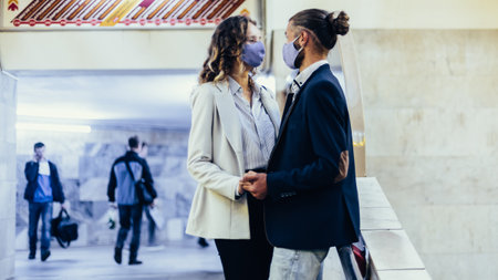 couple in love embraces in the subway crossing.の写真素材