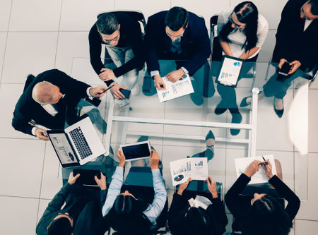business team using a laptop to analyze financial dataの写真素材