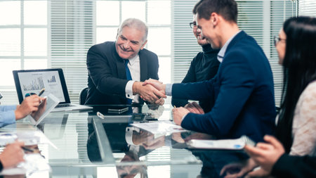 business colleagues shaking hands during a work meeting.の写真素材