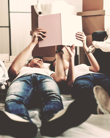 young couple choosing a design for their new apartment.の写真素材