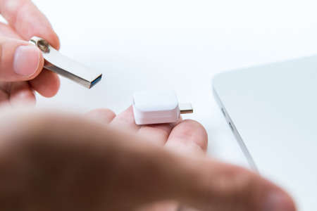 Man uses modern technologies to store memory and digital dataの写真素材