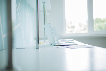 background image of a laptop and business documents on the office Desk.の写真素材