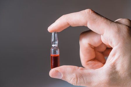 close up. ampoule with the vaccine in hand .の写真素材