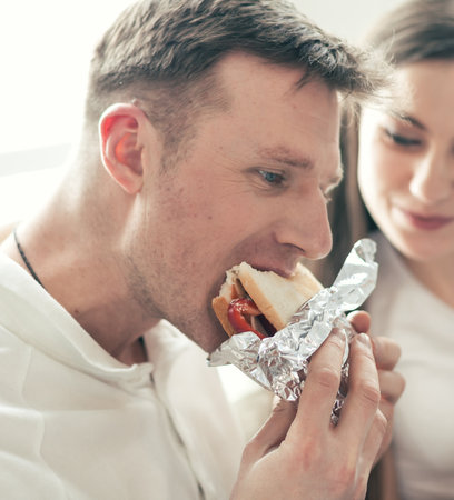 close up. young couple is discussing something sitting on the sofa.の写真素材