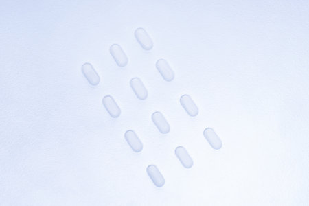 image of white tablets on a white background .