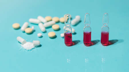 close up. ampoules and tablets on the table.の写真素材