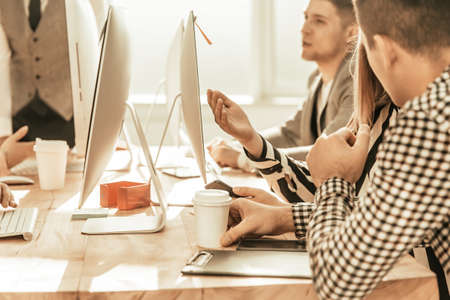 working group is working on a new project in the officeの写真素材