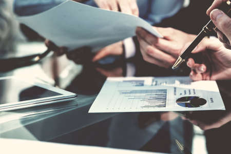 close up. business colleagues checking financial charts.