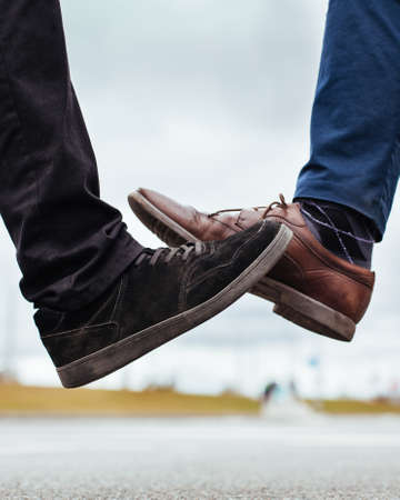 close up. two young men greeting each other on a city street.の写真素材