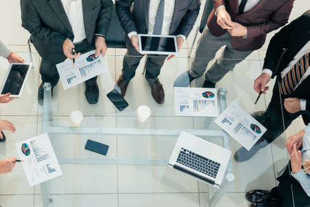 top view. working group with financial documents discussing a new business project .の写真素材