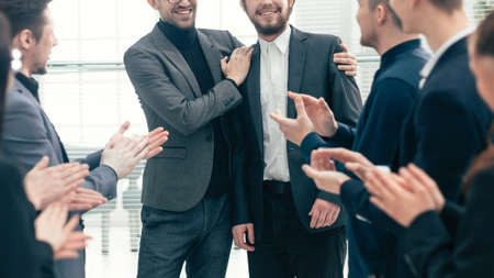 close up. business team congratulating the best employee.