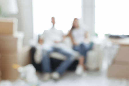 blur image of a young couple in their new apartment .の写真素材