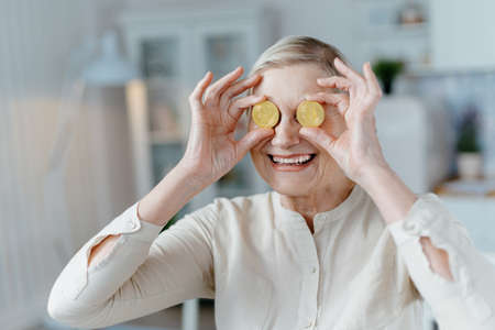 happy attractive lady with bitcoins in her hands.