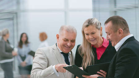 close up. smiling business colleagues discussing business documents.