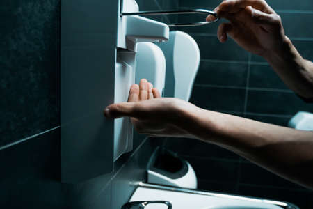 close up. young man using a bactericidal hand washの写真素材