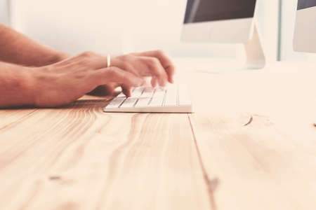 close up. image of a man working on a computerの写真素材