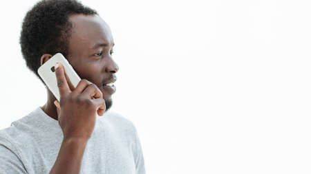 handsome guy with smartphone looking at copy space.