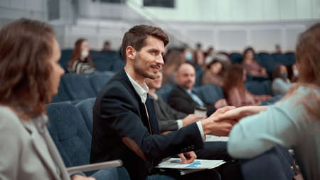 business seminar participants greet each other with a handshakeの写真素材