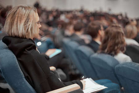 business woman with business documents sitting in the conference hall.の写真素材