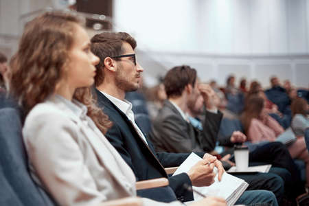 young business people listening to a lecture in the conference hall.