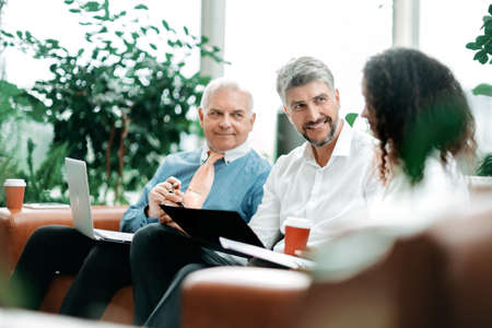 business people considering the terms of a new contract.