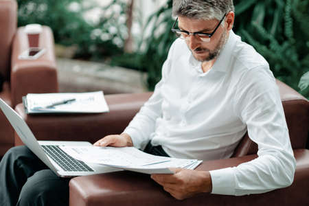 business man works with financial documents . close-up.の写真素材