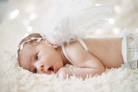 close up. newborn baby angel falling asleep.の写真素材