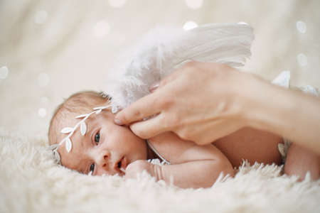close up. newborn baby angel falling asleep.