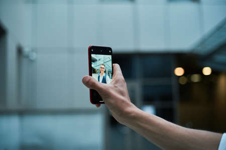 businessman talking to a colleague via video link.の写真素材