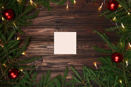 white sheet of paper in a Christmas wreath frame .
