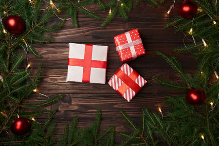 three Christmas gifts on a Christmas background.の写真素材