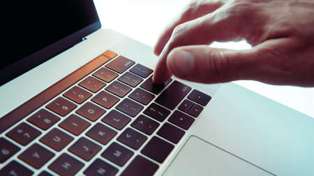close up. man pressing the enter key on the laptop keyboard .の写真素材