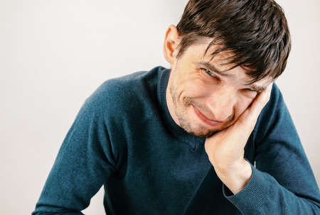 close up. smiling young man sitting at his Desk.