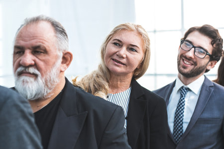 close up. an adult business woman standing in a row of her colleaguesの写真素材