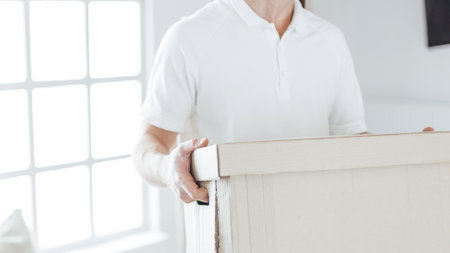 close up. a young couple with boxes in a new apartment.の写真素材