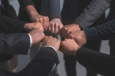 close up . business team showing their unity.の写真素材