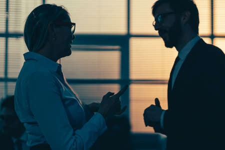 senior businesswoman explaining something to her colleague.の写真素材