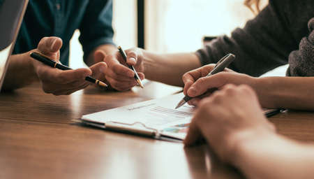 close up. a group of employees discussing a new strategy.の写真素材