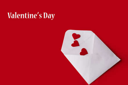 postal envelope with valentines on a red background.の写真素材