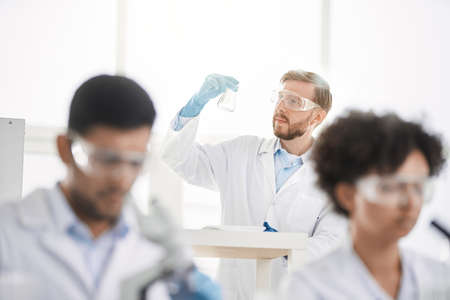 image a group of scientists working in a laboratory.