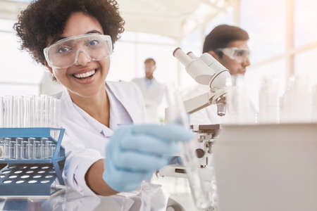 smiling female scientist at the workplace in the laboratory.の写真素材
