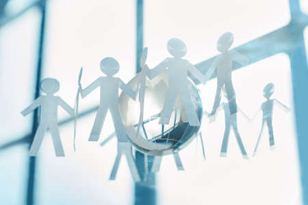 image of a paper business team on an office background.の写真素材