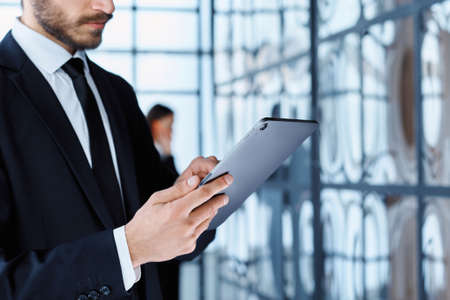 business man using a digital tablet in the office.