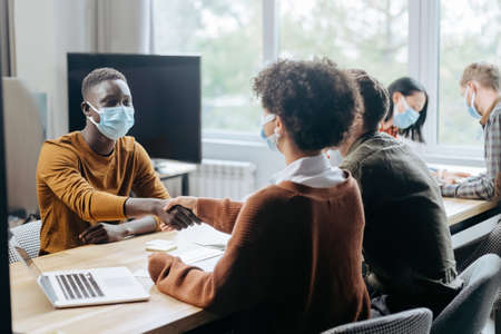 business people making a deal in the hall of the coworking center.の写真素材