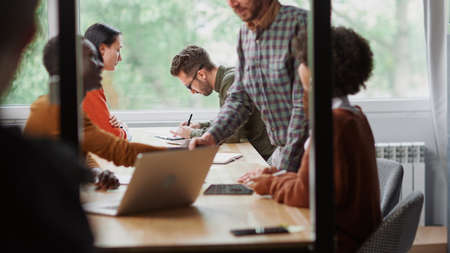 multinational business team works in a modern hall of the cowork