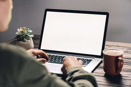 young man using a laptop. rear view .