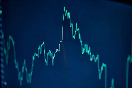 image of the financial graph on a computer monitor.の写真素材