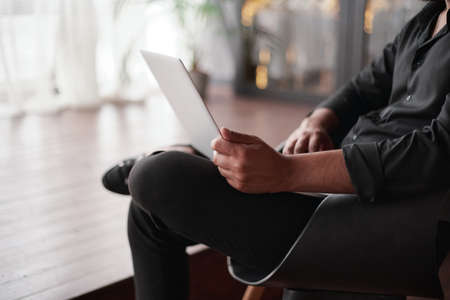 image of a business owner using a laptop in his store.