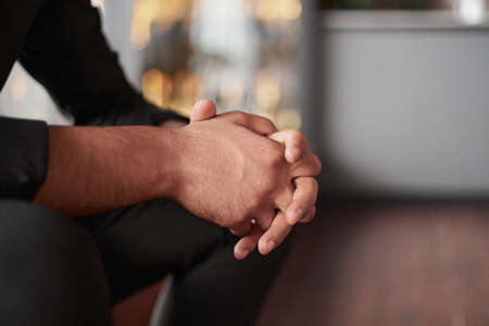 cropped image of a thoughtful business man sitting in a coworking recreation area.