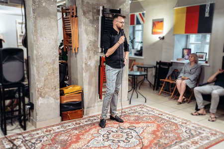 young businessman with a microphone at a public speaking training .の写真素材